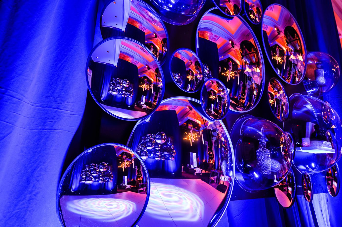 Mirrored spheres under blue light
