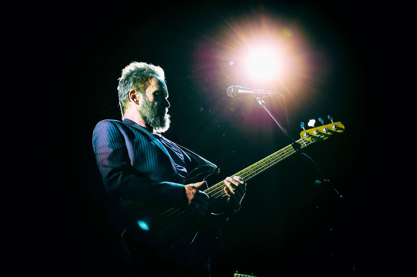 Guitarist under a stage light