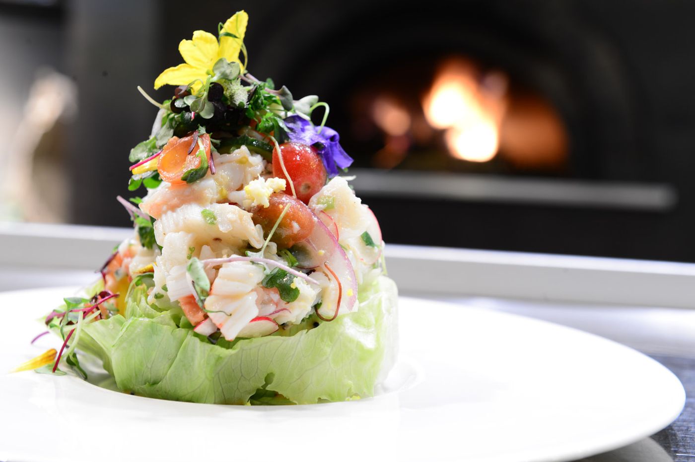Ceviche plated by a wood oven