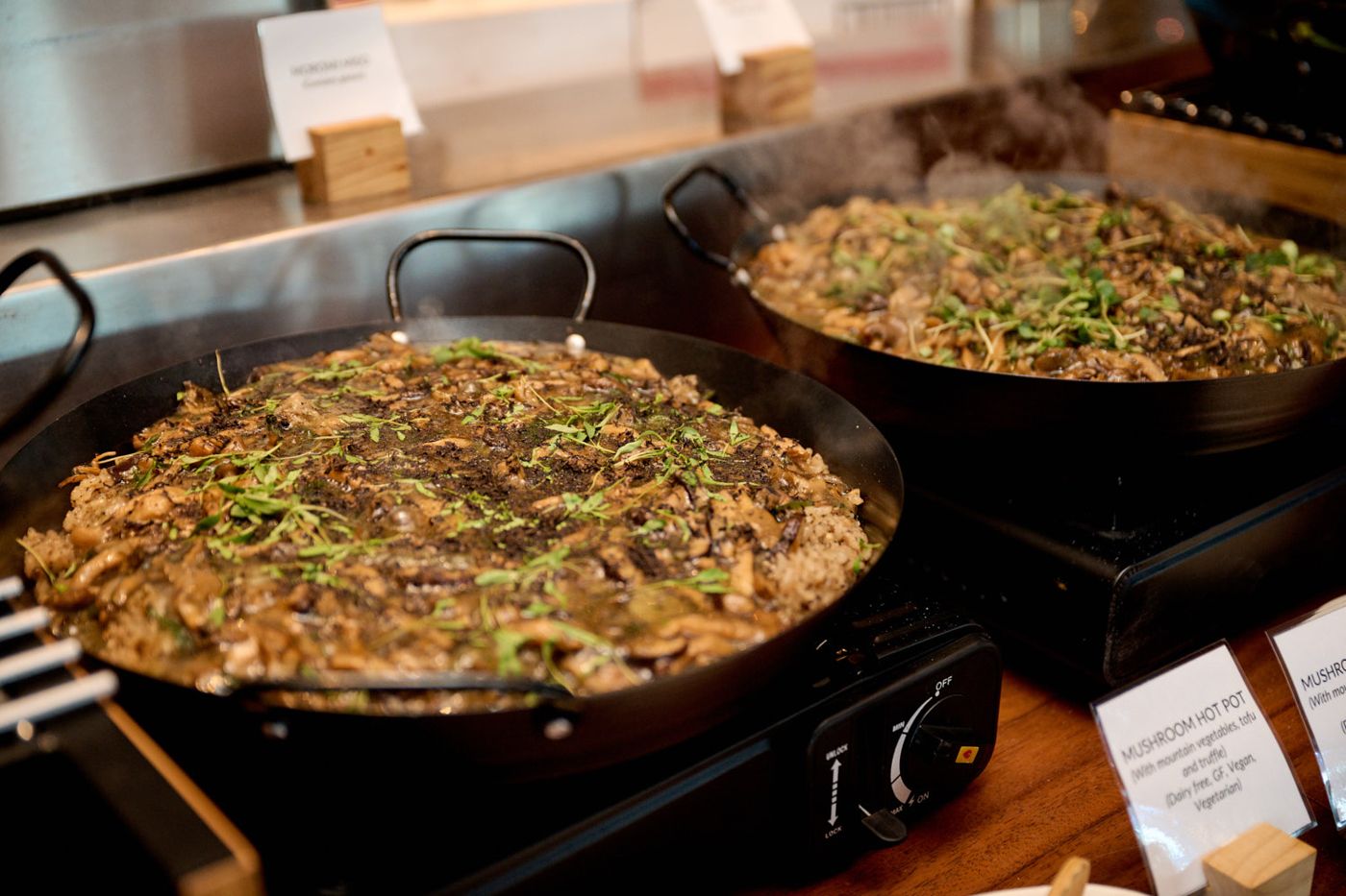 Paella pans at a chef station