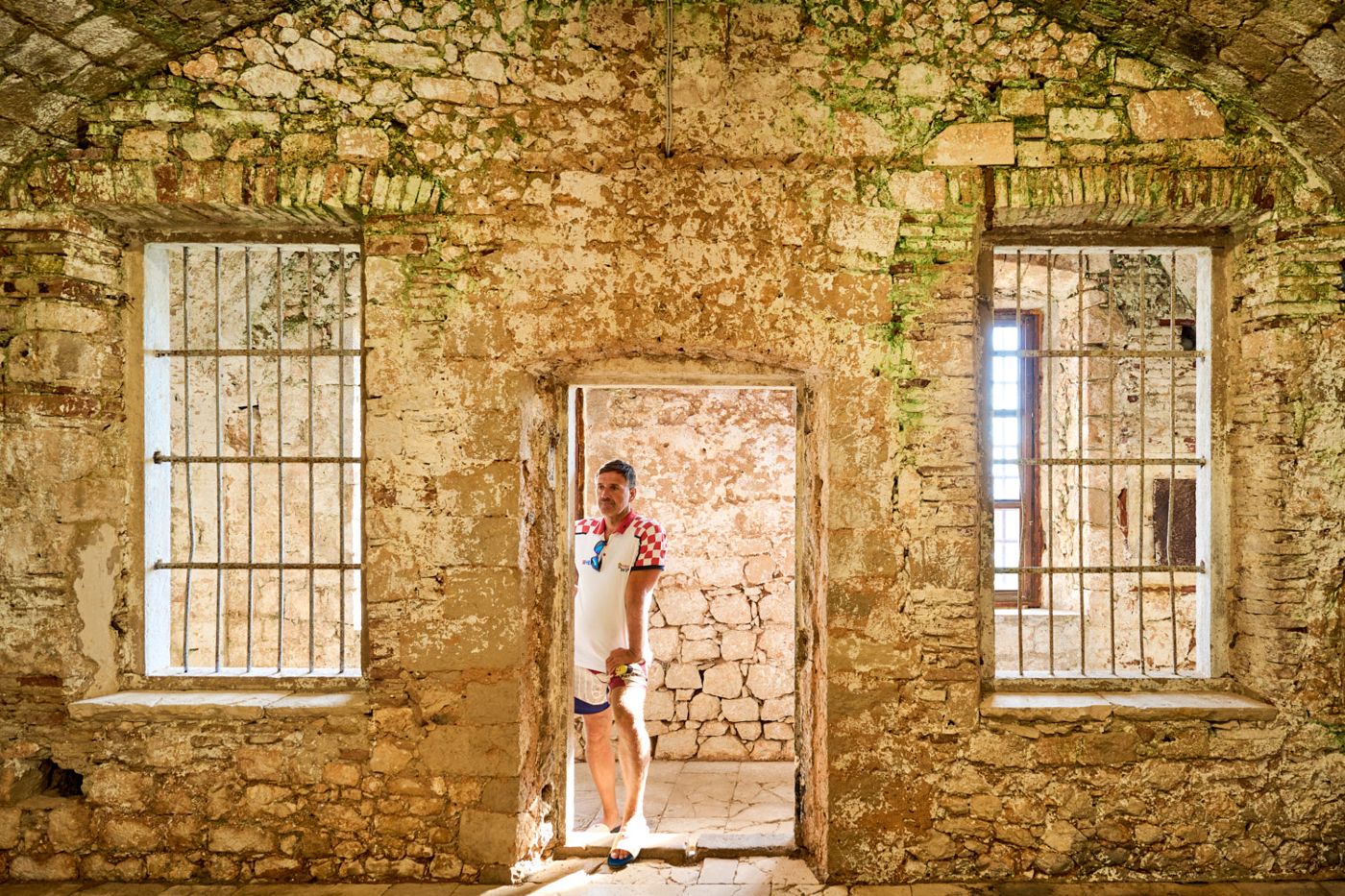 Guest framed in a stone doorway on an excursion