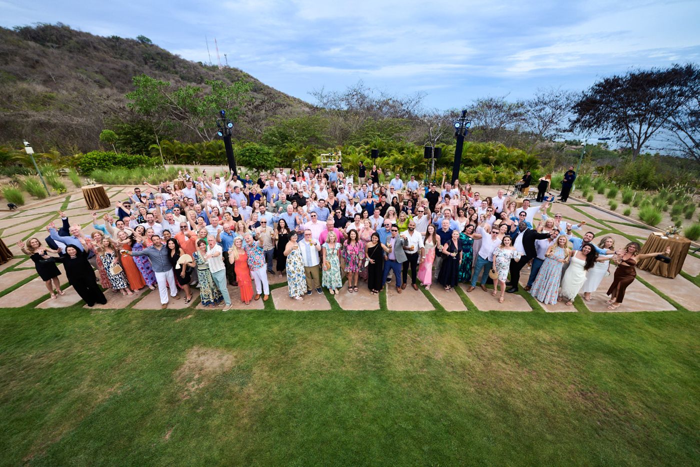 President’s Club group photo on a hillside