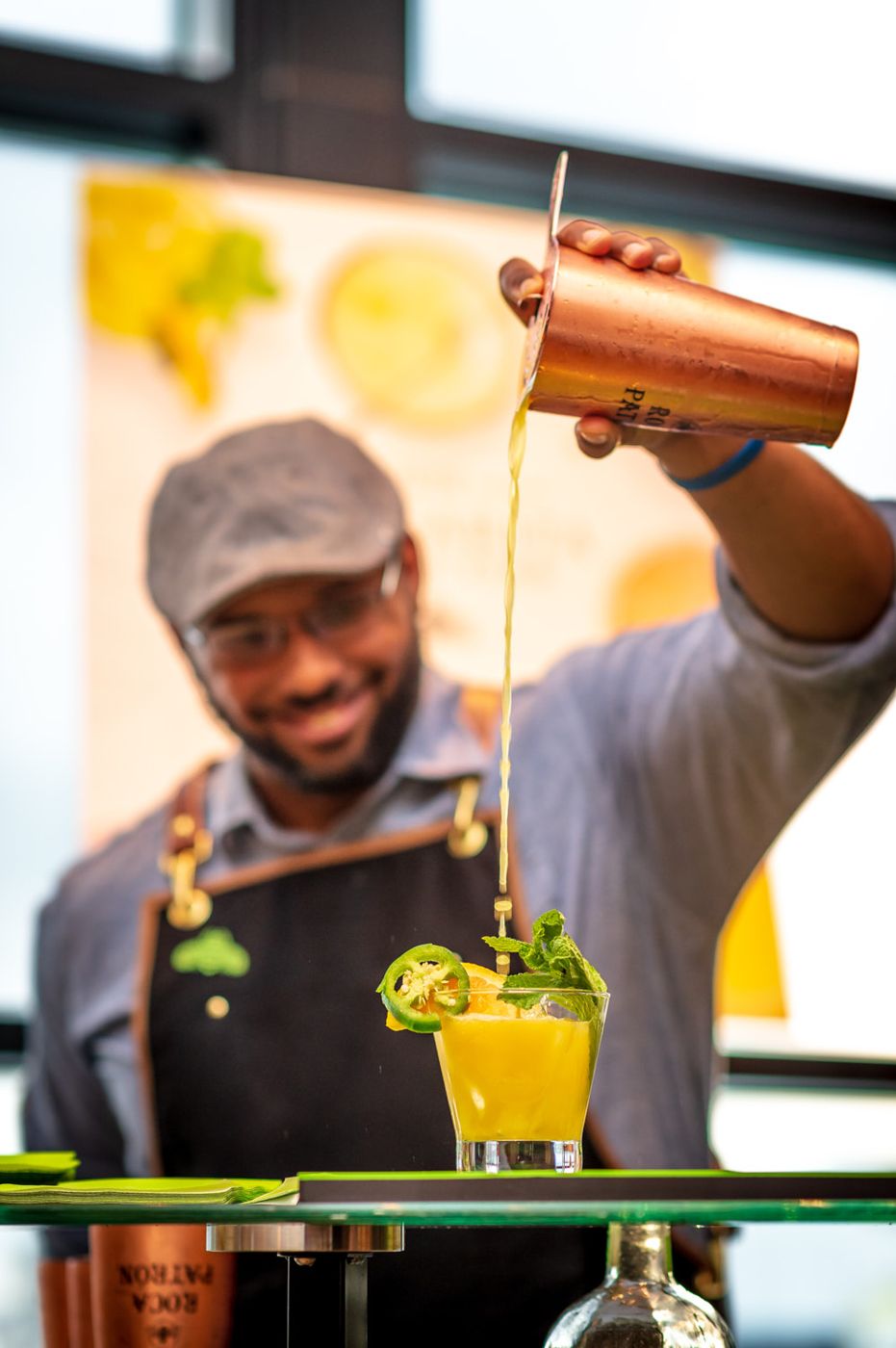 Bartender pouring a signature cocktail